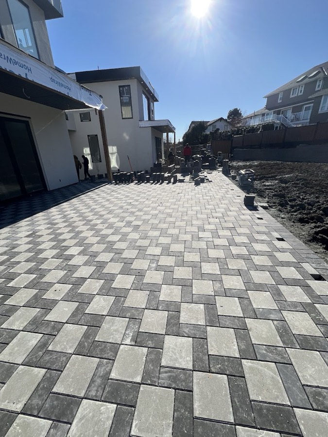 Herringbone paving stone driveway in two tones